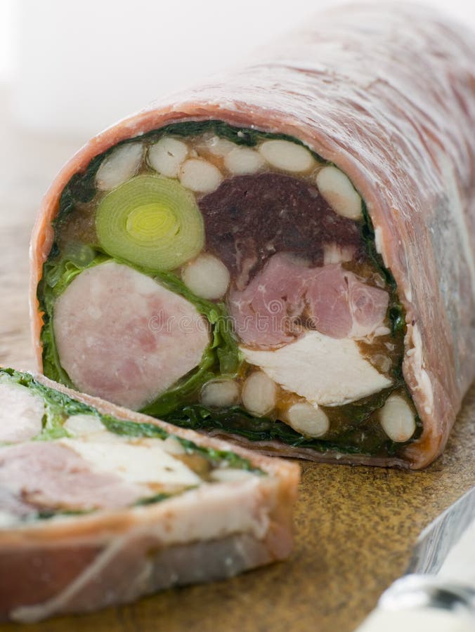 Charcuterie and Haricot Blanc Ragout on chopping board. Charcuterie and Haricot Blanc Ragout on chopping board