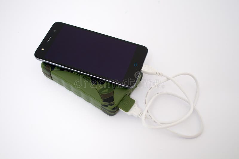 Charge your phone with the help of the military power bank packs stock images Charge your phone with the help of the military power bank packs stock images