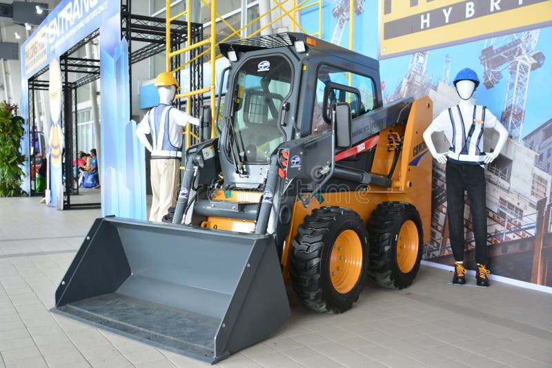 PASAY, PH - NOV 11 - Lonking skid steer loader at Philconstruct on November 11, 2023 in Pasay, Philippines. Philconstruct is a annual construction show in Philippines. PASAY, PH - NOV 11 - Lonking skid steer loader at Philconstruct on November 11, 2023 in Pasay, Philippines. Philconstruct is a annual construction show in Philippines