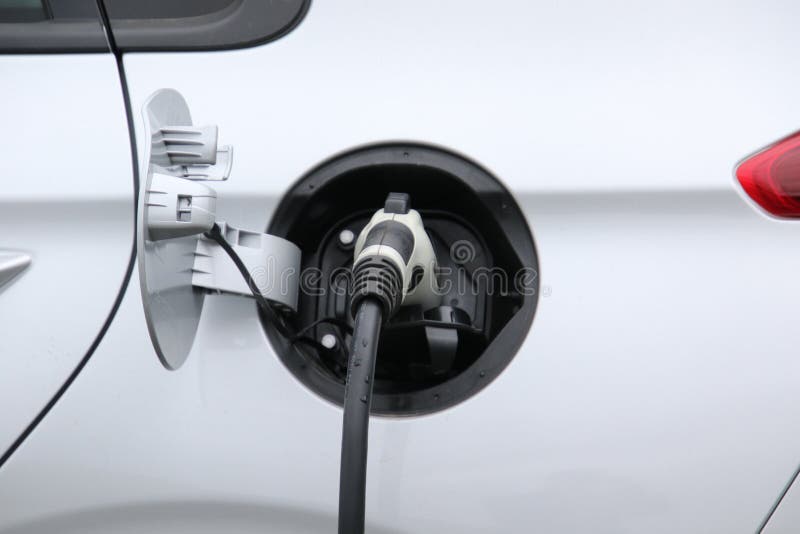 A Charging Cable Plugged into a Car Stock Photo Image of power, auto