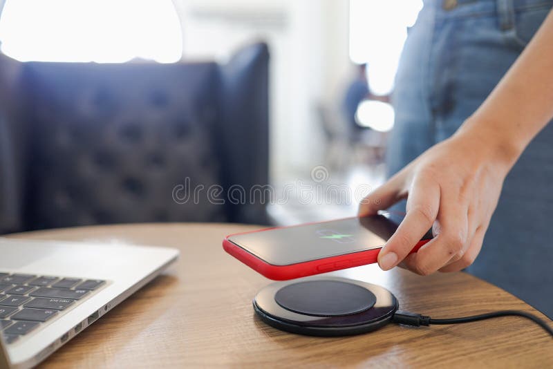 Charging Mobile Phone Battery with Wireless Charging Device in the