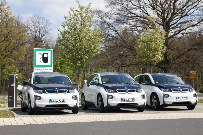 Frankfurt, Germany - March 30, 2017: Three BMW i3 electric vehicles at a charging station. Frankfurt, Germany - March 30, 2017: Three BMW i3 electric vehicles at a charging station