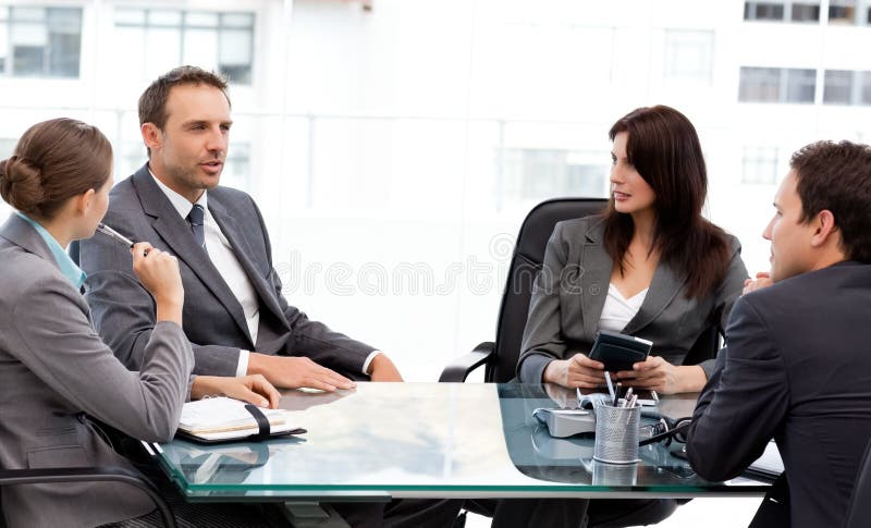 Charismatic businessman talking to his partners royalty free stock photo Charismatic businessman talking to his partners royalty free stock photo