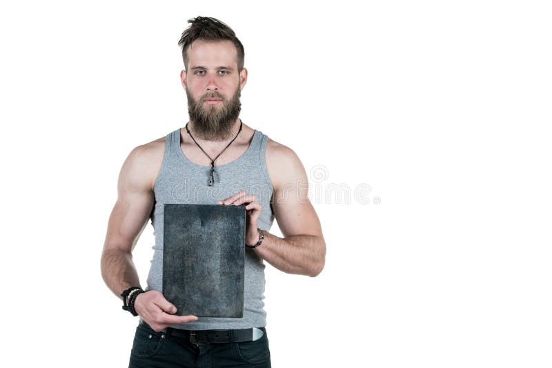 A charismatic man with a beard holds an empty sign for a copy space, on a white isolated background. Horizontal frame stock photography