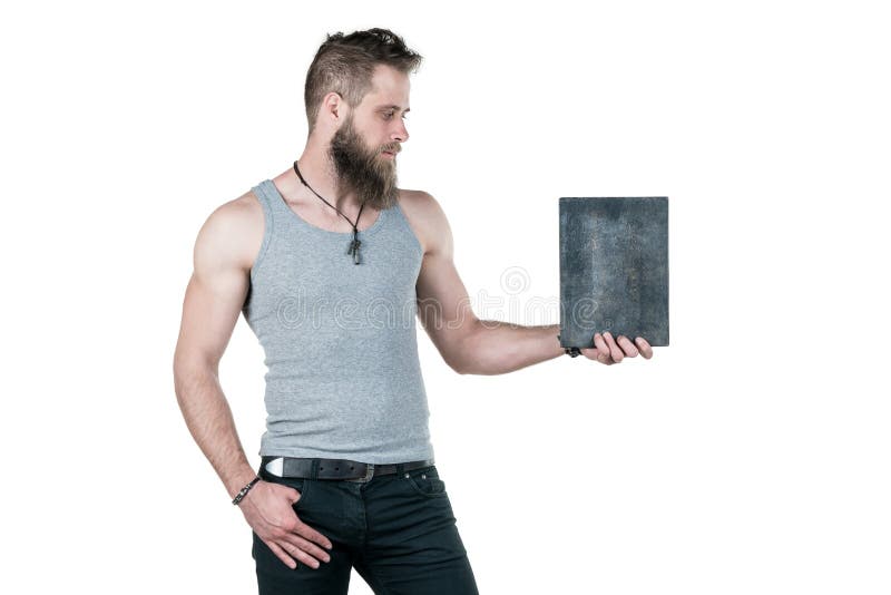 A charismatic man with a beard holds an empty sign for a copy space, on a white isolated background. Horizontal frame royalty free stock photography