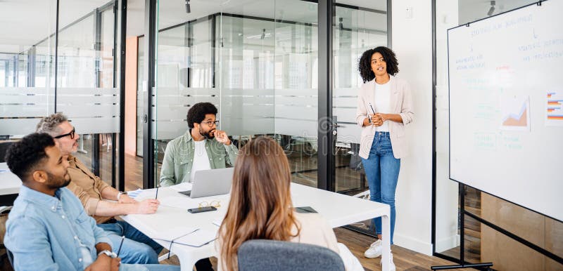 Colleagues engage in a lively exchange of ideas in an office royalty free stock images