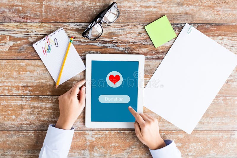 Close Up of Hand with Donate Icon on Tablet Pc Stock Image Image of