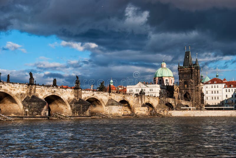 Charles bridge across the river in old town of Praha