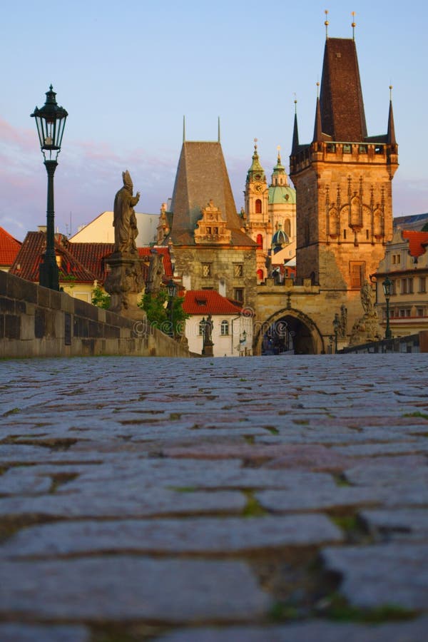 Entrance towers of Charles Bridge with St.Nicholas Cathedral.Prague, Czech Republic