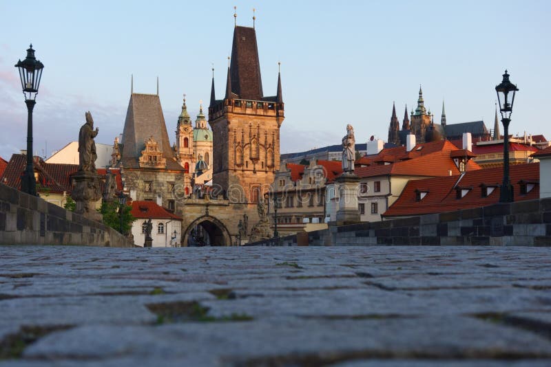 Entrance towers of Charles Bridge with St.Nicholas Cathedral.Prague, Czech Republic