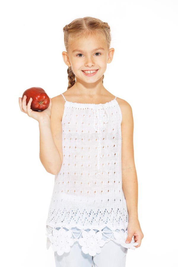 Charmig flicka med ett äpple royaltyfria bilder Charmig flicka med ett äpple royaltyfria bilder