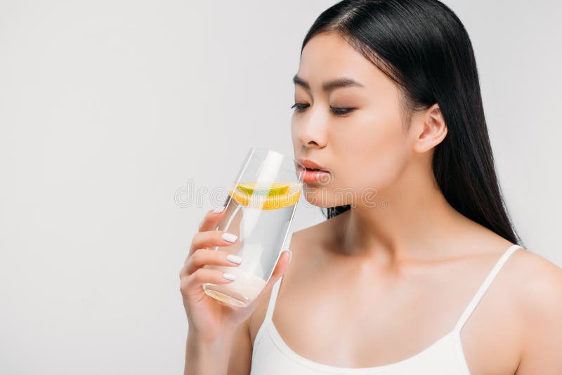 https://thumbs.dreamstime.com/b/charming-asian-girl-drinking-pure-water-lemon-charming-asian-girl-drinking-pure-water-lemon-isolated-grey-127753646.jpg