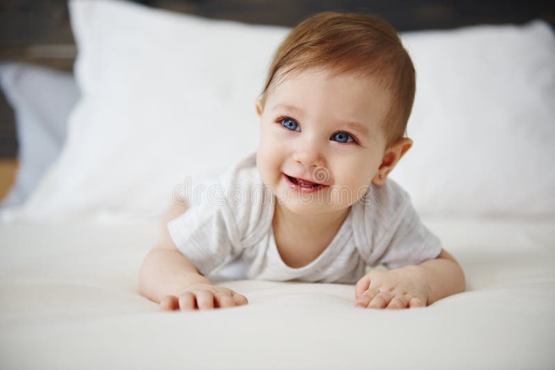 Charming Baby Lying On The Bed Stock Image Image Of Bedroom Effort