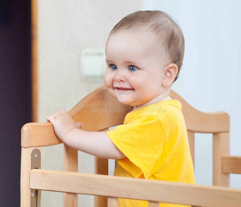 Charming child in the crib stock photo. Image of domestic 29247498