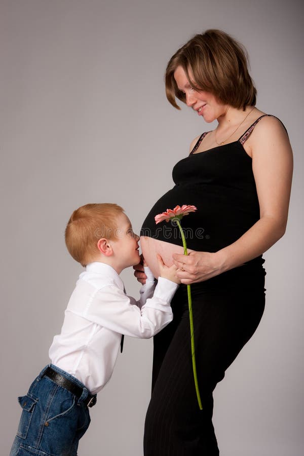 Charming expectant mother with son