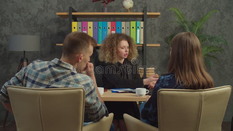 Pretty Female Real Estate Agent Showing House Design To Married Couple Stock Footage Video Of 