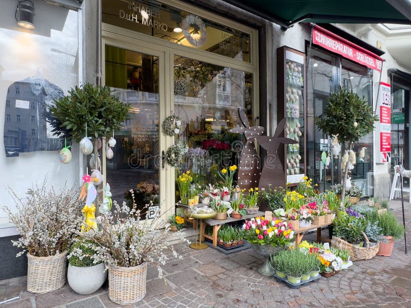 Charming floral shop exterior with spring blossoms and easter decorations in austria royalty free stock images