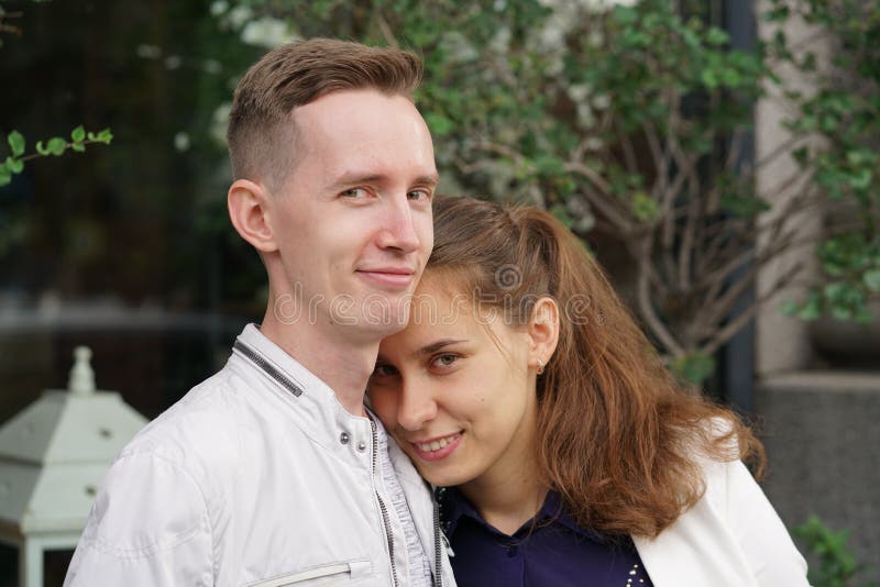 Charming Good Couple Husband And Wife Walking Around The City Hugging