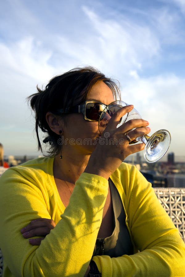 Charming Lady in Yellow Drinks Wine from Glass Stock Photo - Image of ...