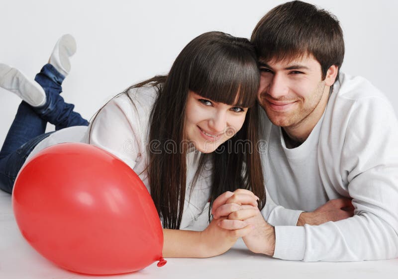 Charming love couple lying on the floor