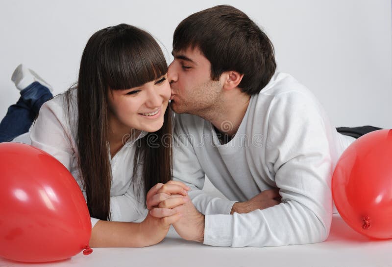 Charming love couple lying on the floor