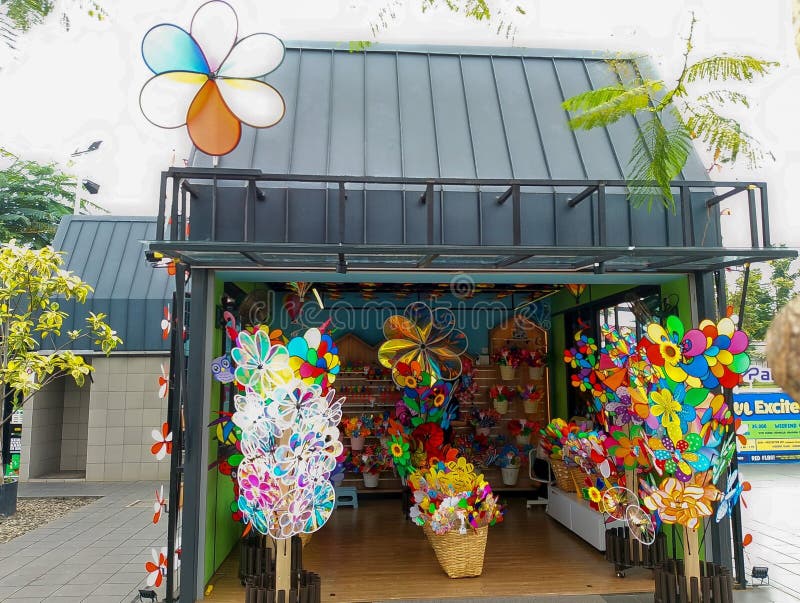 Vibrant Shop Display of Colorful Pinwheels and Wind Spinners. royalty free stock images