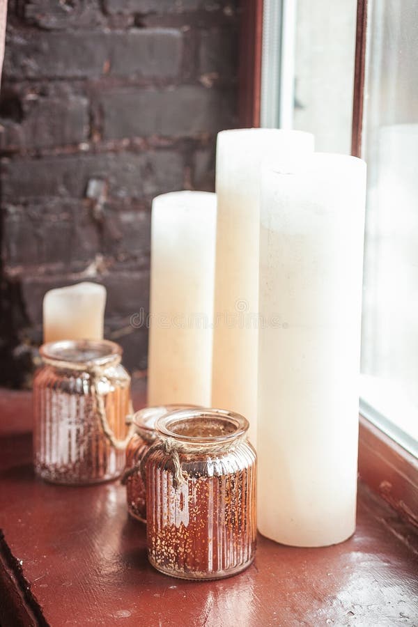 Charming White Candles and Glass Vase Standing on the Windowsill Stock Photo Image of evening