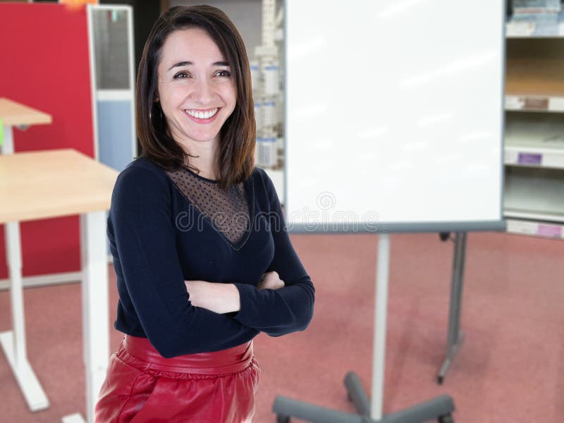 A charming woman businesswoman manager makes a presentation in front of the whiteboard stock images A charming woman businesswoman manager makes a presentation in front of the whiteboard stock images