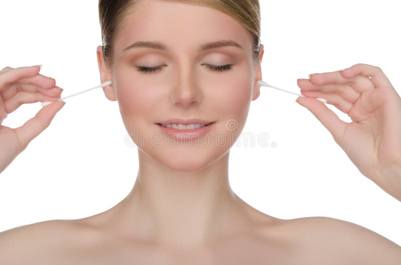 Charming woman cleans ears with cotton sticks