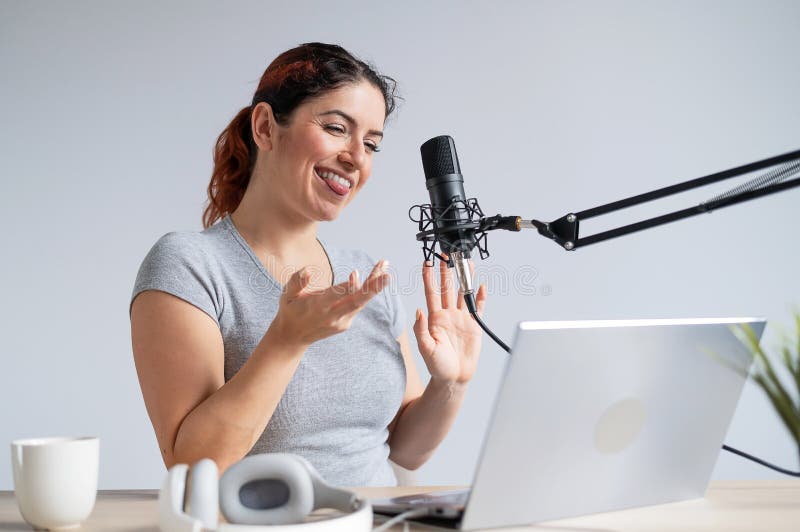 A Charming Woman Radio Host is Broadcasting Live on a Laptop. Online