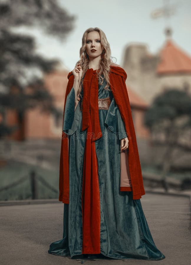 Gorgeous young princess in the medieval dress with red cape