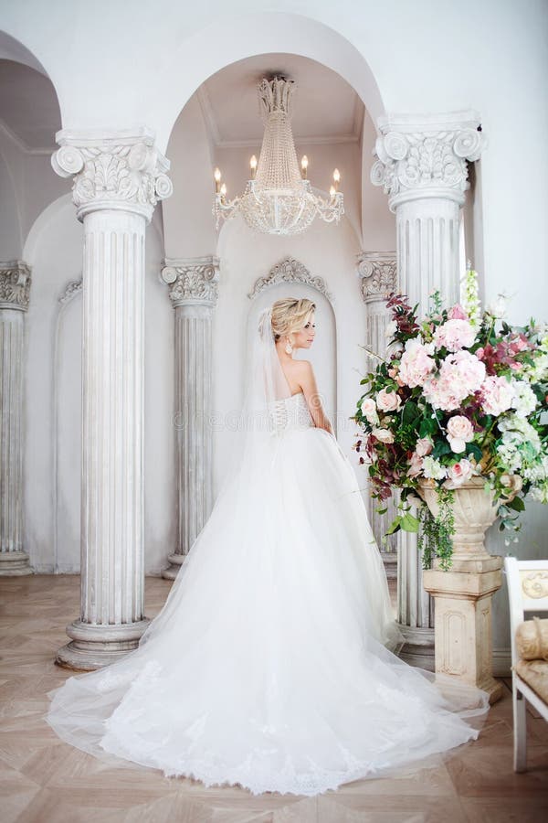 Charming young bride in luxurious wedding dress. Pretty girl, the photo Studio