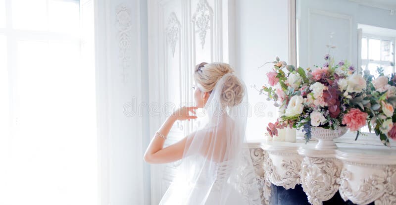 Charming young bride in luxurious wedding dress. Pretty girl, photo Studio