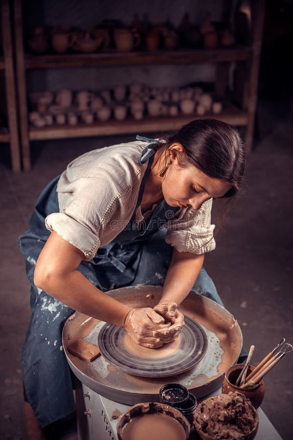 Stylish Pottery Woman Siting on Bench with Pottery Wheel and Making Clay  Pot. National Craft. Stock Photo - Image of handicrft, shape: 147147962