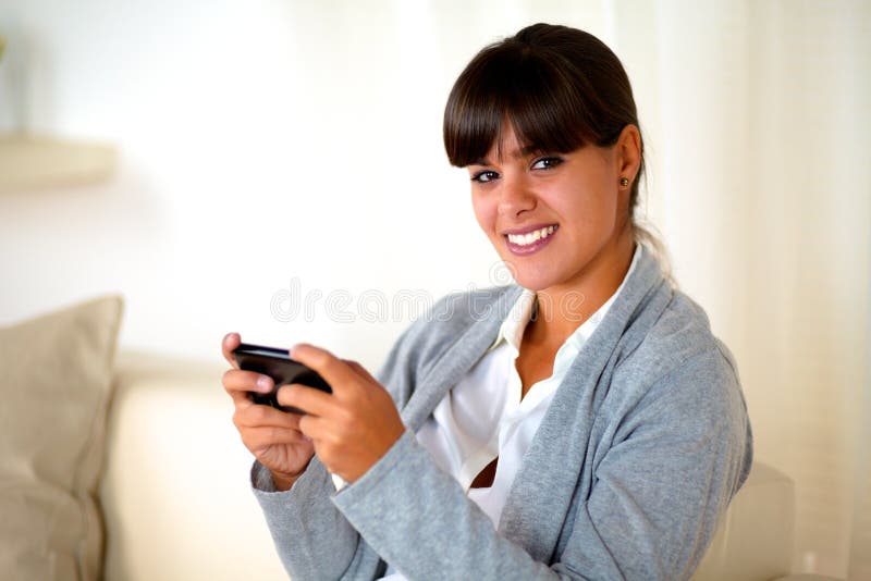 Charming Young Woman Sending Message by Cellphone Stock Image Image