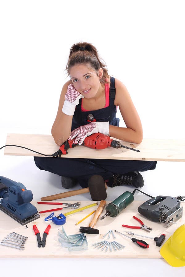 Woman carpenter with work tools on wooden plank. Woman carpenter with work tools on wooden plank