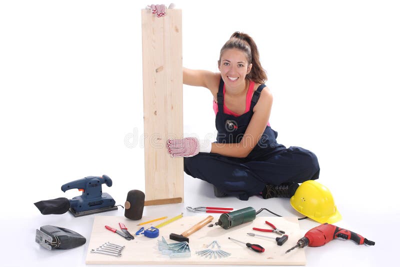 Woman carpenter with work tools on wooden plank. Woman carpenter with work tools on wooden plank