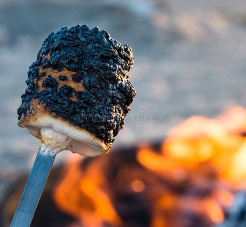 https://thumbs.dreamstime.com/b/charred-marshmallow-ready-smore-s-skewer-being-roasted-beach-fire-chocolate-graham-crackers-122855866.jpg