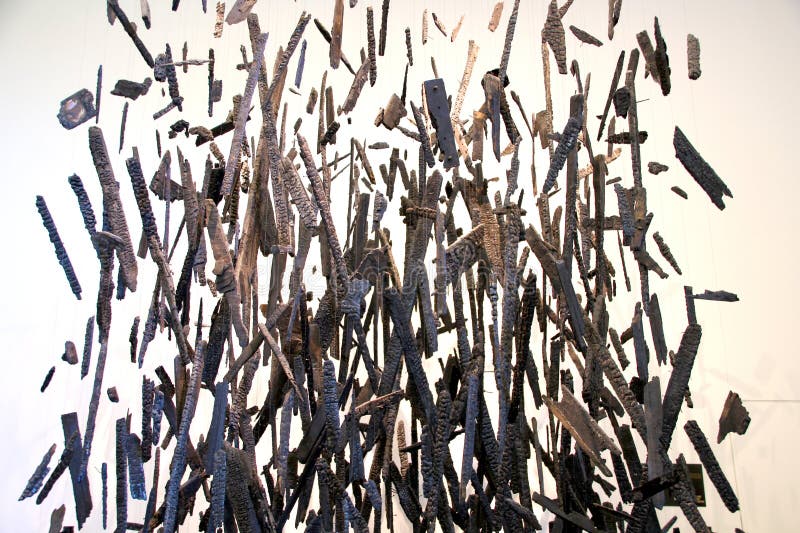 Conceptual image of charred pieces of wood floating in the air royalty free stock photo