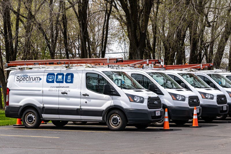 LA CROSSE, WI,USA - APRIL 17, 2021 - Charter Spectrum telecommunications fleet vehciles and  trademark logo. LA CROSSE, WI,USA - APRIL 17, 2021 - Charter Spectrum telecommunications fleet vehciles and  trademark logo