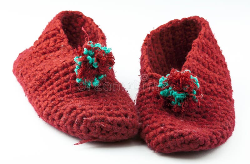 Chaussons tricotés par rouge photo libre de droits Chaussons tricotés par rouge photo libre de droits