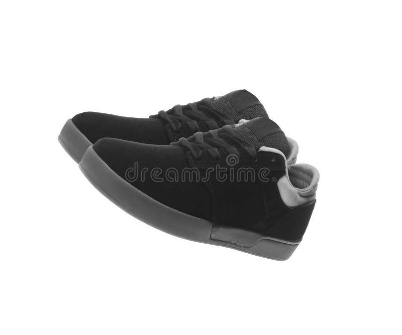 Chaussures noires d'isolement sur le blanc photos stock