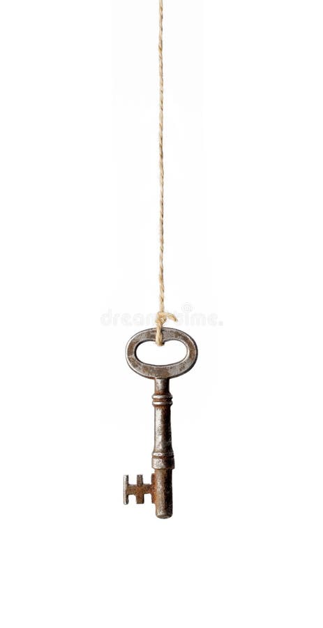 Old antique rusty key hanging from a string. Old antique rusty key hanging from a string.