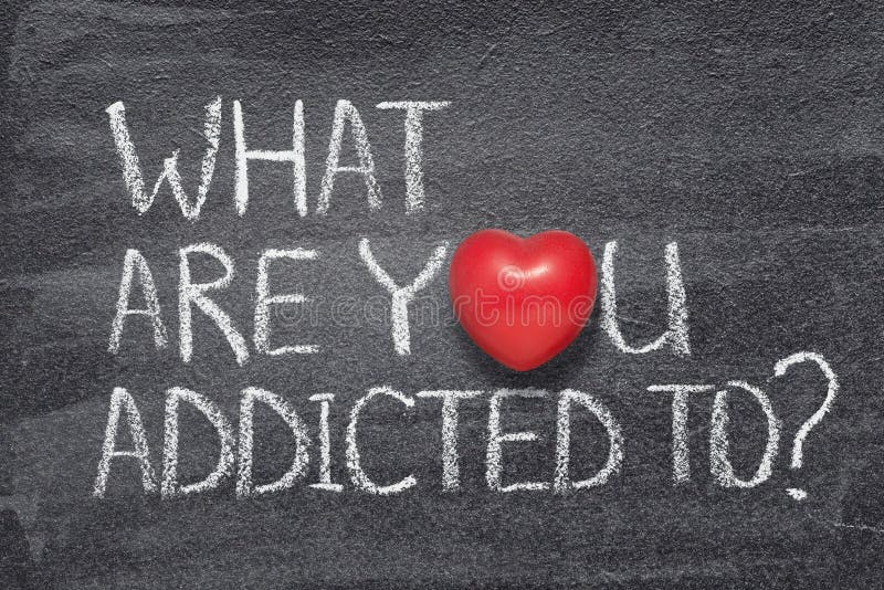 What are you addicted to question handwritten on chalkboard with red heart symbol instead of O. What are you addicted to question handwritten on chalkboard with red heart symbol instead of O