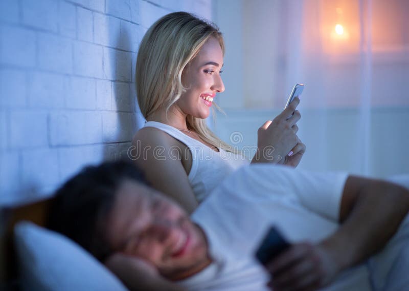 Couple Texting On Phone Lying In Bed At Night Stock Image - Image of Google Couple Texting In Bed R 34