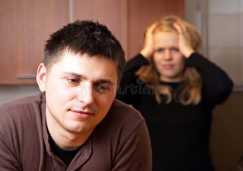 Family scene in kitchen, wife and husband talking. Cheating husband.