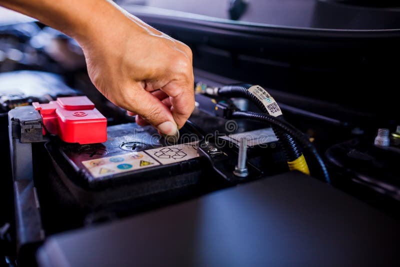 Check and Maintenance the Battery in Car with Yourself Stock Image