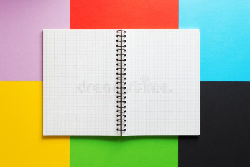 Checked notebook at abstract colorful paper royalty free stock photos Checked notebook at abstract colorful paper royalty free stock photos