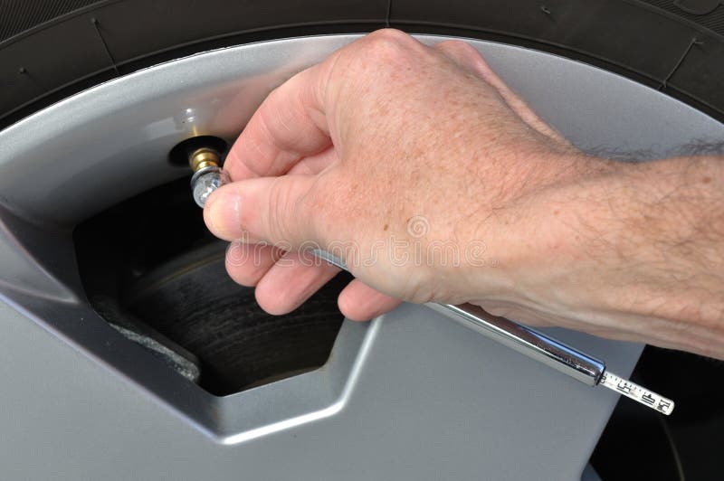 Checking the Air Pressure of a Tire Stock Image Image of gauge