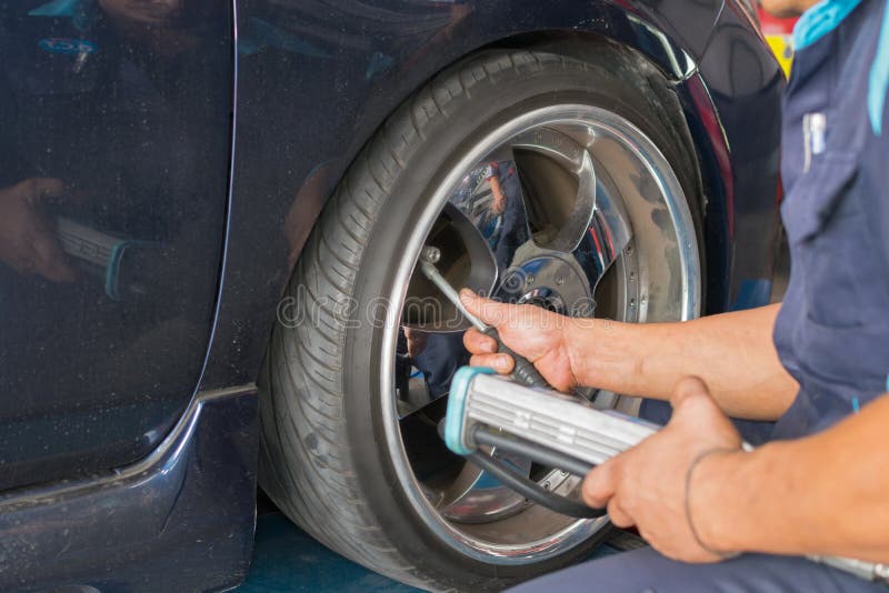 Checking Car Suspension and Tire Pressure Stock Photo Image of lift